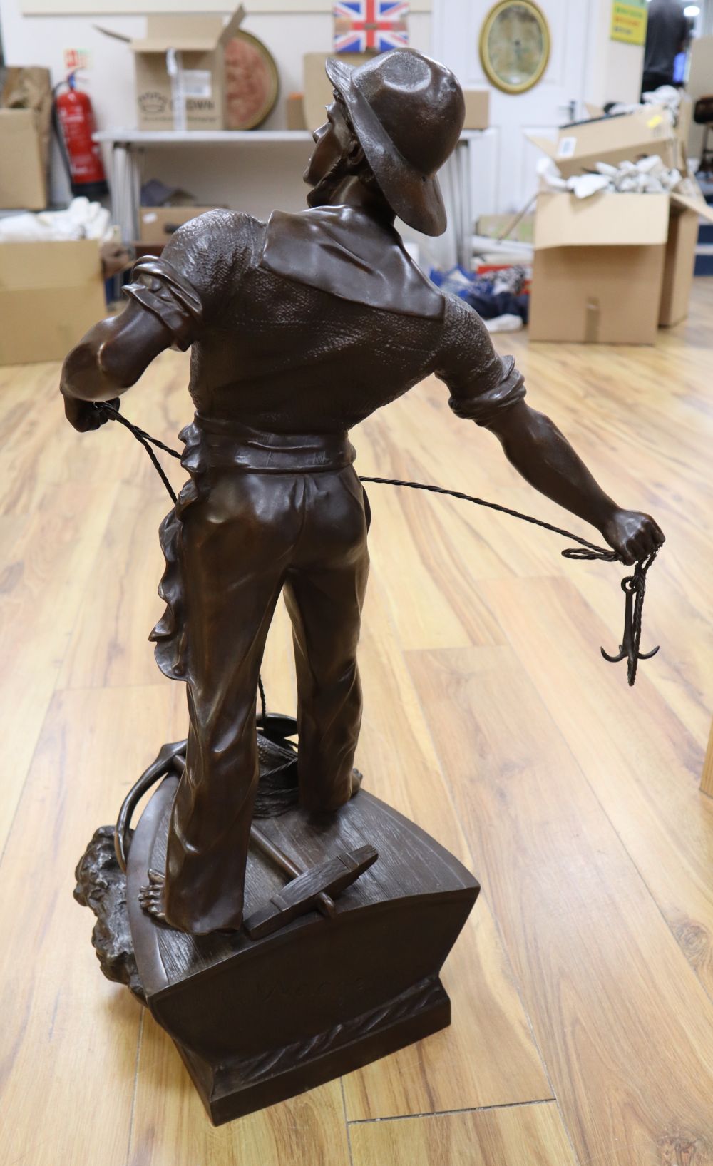 After Waagen Sept. A bronzed spelter model of a fishermen Secours, signed, 72cm